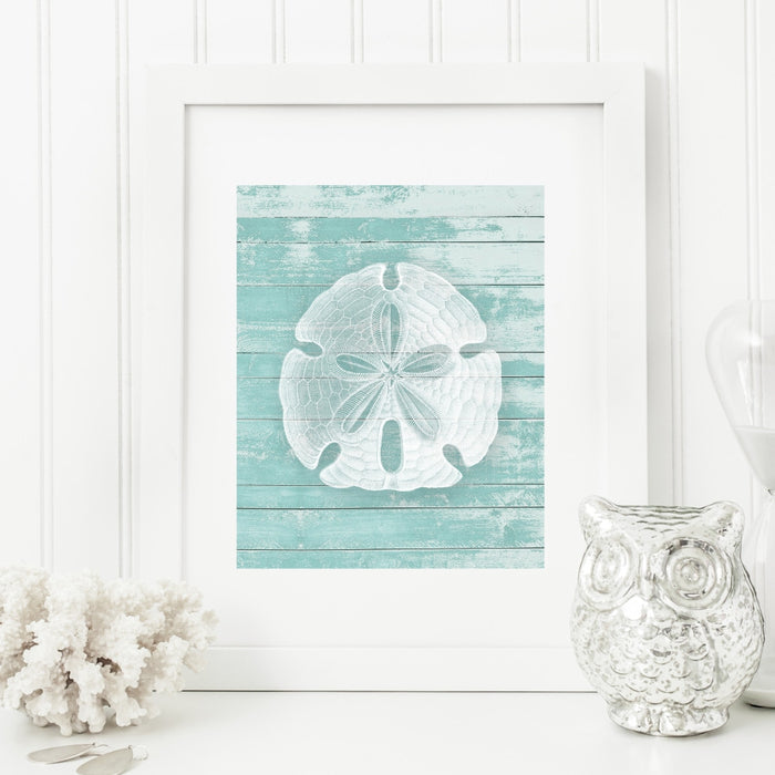 Sand Dollar Wall Art in Teal on a Faux Wood Background
